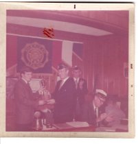 Bronson Gridley awarding a trophy